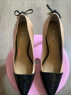 levity Beige Flats with Black Pointed Toe and Bow Accent